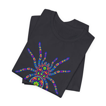 Vibrant Huichol tarantula graphic tee featuring rainbow Mexican folk art patterns.