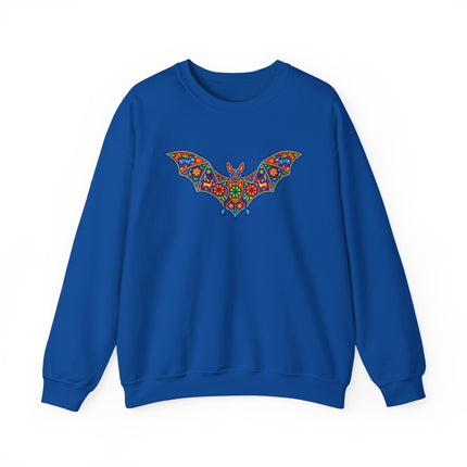 Vibrant Mexican folk art bat graphic on a blue sweatshirt. Huichol style mandala design.