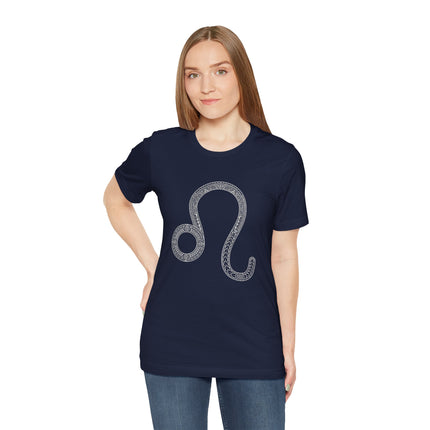 Intricate white Leo zodiac symbol on a dark blue graphic t-shirt.