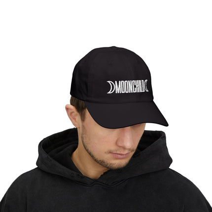 Black baseball cap with embroidered Moonchild text and crescent moon symbol.