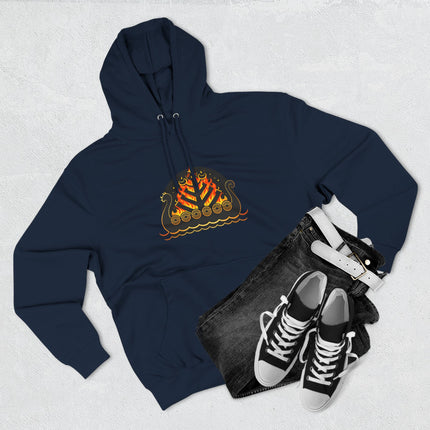 Fiery Viking longship graphic on a dark blue Norse mythology hoodie.