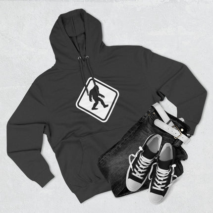 Bigfoot Sasquatch warning sign graphic on a black hoodie.
