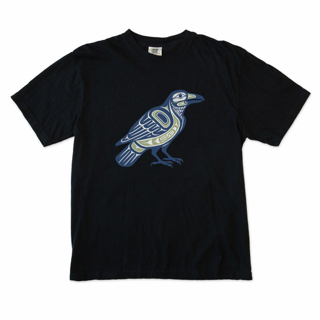 Graphic tee featuring an Inuit inspired raven symbol in Pacific Northwest Indigenous art style.