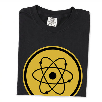 Retro science t-shirt displaying a stylized golden atomic symbol emblem design.