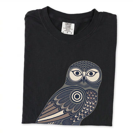 Geometric tribal owl graphic print on an Inuit-inspired t-shirt.