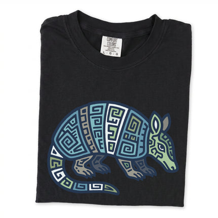 Geometric Mayan armadillo tribal graphic tee in blue and green tones.