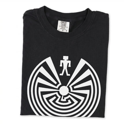 Man in the Maze graphic with I'itoi Native American symbol printed on a comfortable t-shirt.