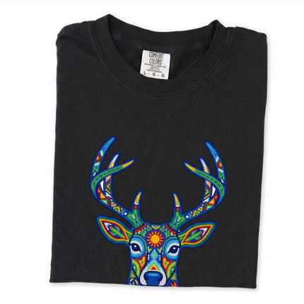 Huichol deer graphic tee featuring vibrant Mexican folk art style design.