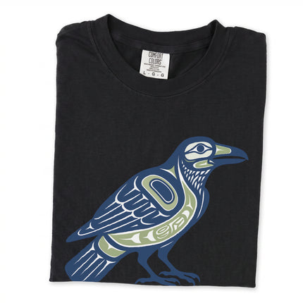 Inuit-inspired raven symbol graphic tee featuring Indigenous Pacific Northwest art and tribal designs.