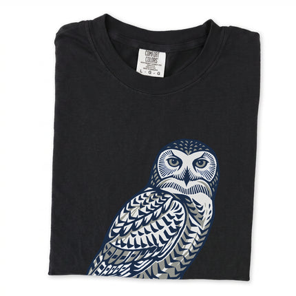 Geometric stylized owl graphic on a unisex tee shirt, featuring an arctic bird design inspired by Inuit art.