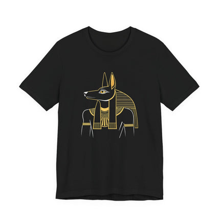 Minimalist gold Anubis Egyptian jackal god graphic tee on a black t-shirt.