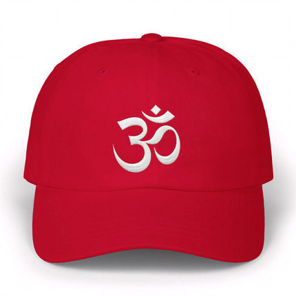 Red baseball cap featuring white embroidered Om (Aum) symbol for spiritual or yoga style.