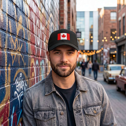 Black baseball cap with red Canadian maple leaf logo.