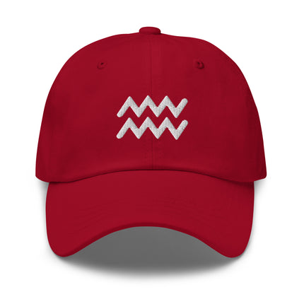 Embroidered Aquarius zodiac symbol on an unstructured baseball cap.