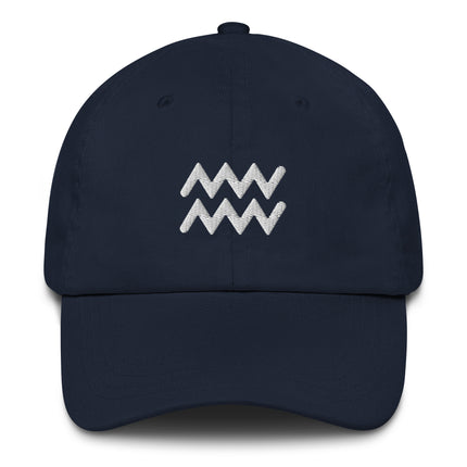 Embroidered Aquarius zodiac symbol graphic on an unstructured baseball cap.