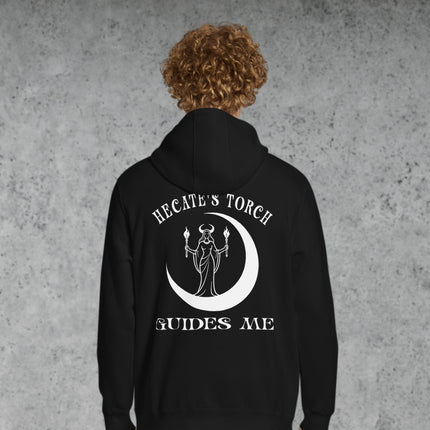 Hecate's Torch Guides Me Back" print hoodie featuring witchy moon goddess and celestial design.