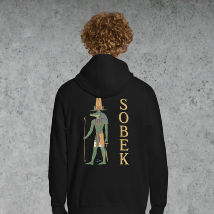 Sobek, the ancient Egyptian crocodile god, printed on a mythological style pullover hoodie.