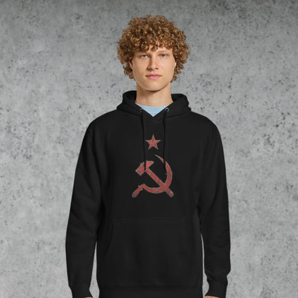 Distressed red hammer and sickle symbol on a pullover hoodie.