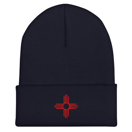Zia Sun embroidered cuff beanie featuring a red four-direction symbol design.
