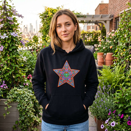 Black hoodie featuring a vibrant geometric star print, inspired by Huichol indigenous art.