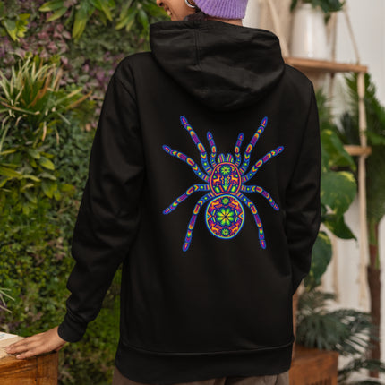 Colorful Huichol tarantula art print on a black hoodie. Mexican folk art spider design.