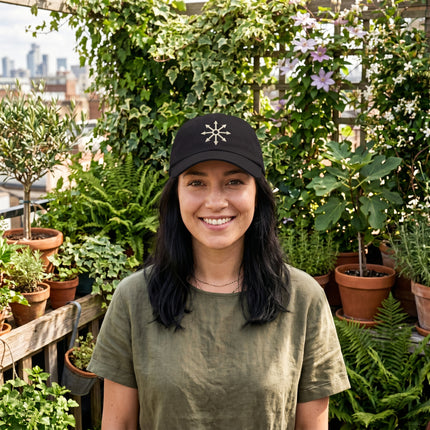 Black baseball cap embroidered with the Chaos Star occult symbol.