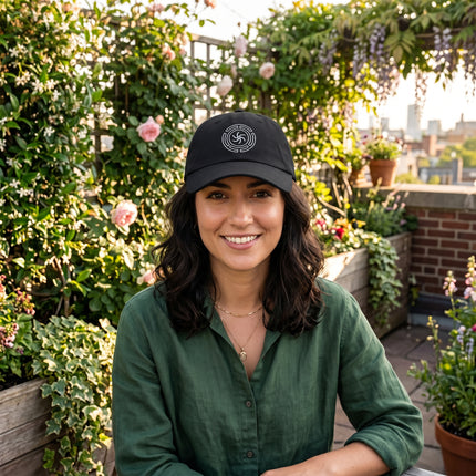 Black baseball cap with embroidered Hekate's Wheel (Strophalos) occult symbol.