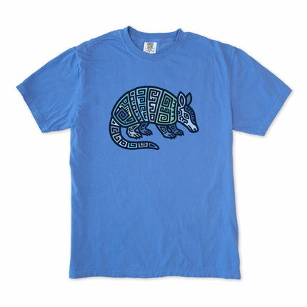 Tribal Mayan armadillo graphic tee shirt featuring geometric blue and green art.