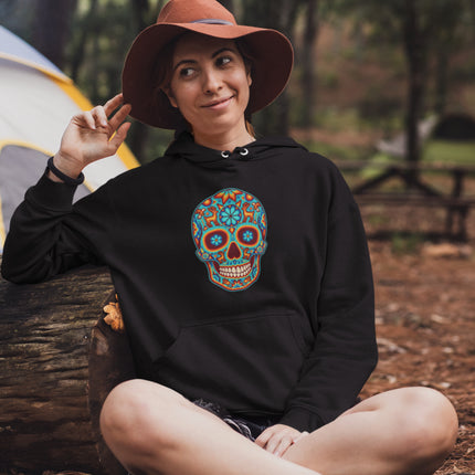 Colorful Huichol Day of the Dead sugar skull design on a comfortable pullover hoodie.
