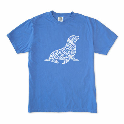 Tribal swirl seal graphic tee featuring ornate marine life artwork on a comfortable shirt.