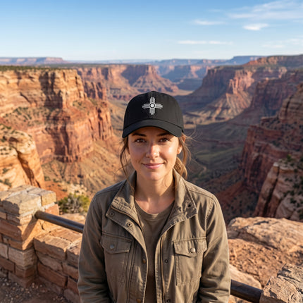Black baseball cap featuring the embroidered Zia Sun symbol.