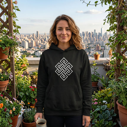 Black hoodie featuring the white Endless Knot symbol. Buddhist spiritual graphic.