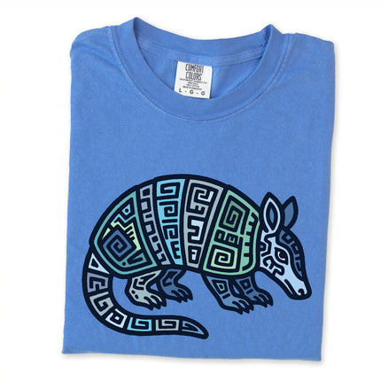 Tribal Mayan armadillo t-shirt featuring geometric blue and green graphics.