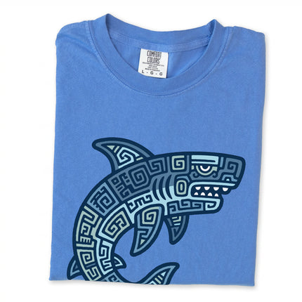 Blue geometric tribal shark shirt with Mayan-inspired oceanic pattern on a blue tee.