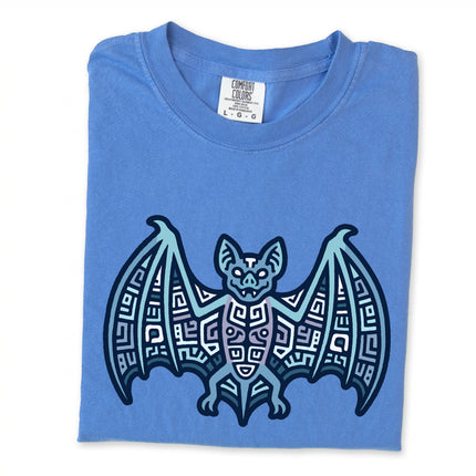 Geometric blue and indigo t-shirt featuring a tribal Mayan bat symbol graphic design.