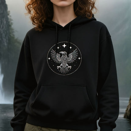 Black hoodie featuring a Norse raven knotwork graphic. Viking mythology apparel.