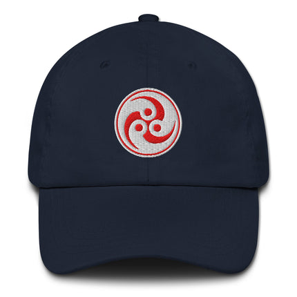 Red baseball cap with embroidered Japanese Tomoe and Mitsudomoe symbols.