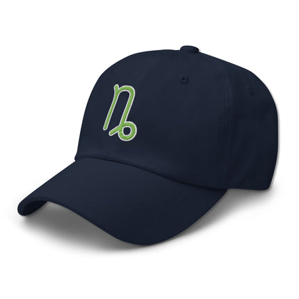Green embroidered baseball cap featuring the Capricorn zodiac symbol for astrology fans.