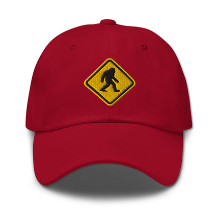Embroidered Bigfoot crossing sign cap featuring a Sasquatch warning symbol design.
