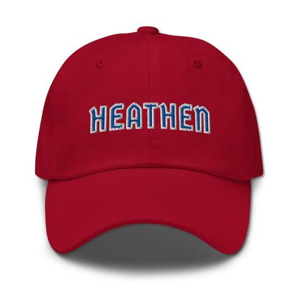 Blue and white dad hat with embroidered "Heathen" text design on unstructured baseball cap.