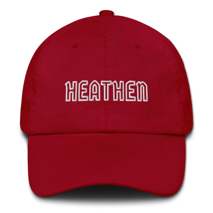Embroidered "Heathen" text dad hat on unstructured cotton baseball cap.