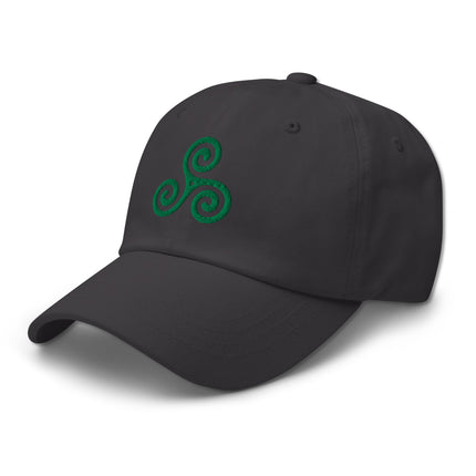 Embroidered green baseball cap featuring the Celtic Triskelion symbol.