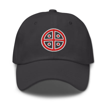 Red dad hat with embroidered solar cross symbol.