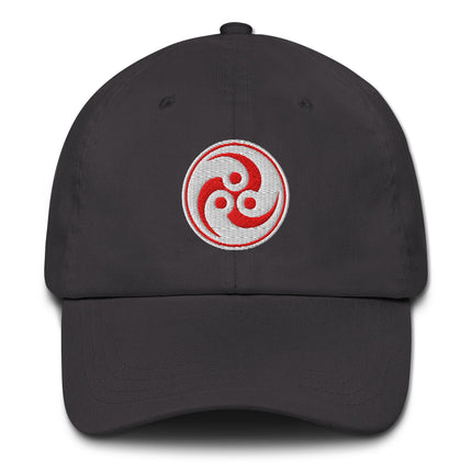Red embroidered baseball cap featuring traditional Japanese Tomoe and Mitsudomoe symbols.