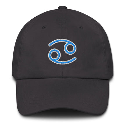Blue dad hat embroidered with the Cancer zodiac sign and astrology symbol.
