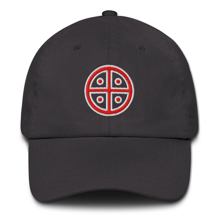 Red dad hat featuring embroidered solar cross symbol on a red baseball cap.