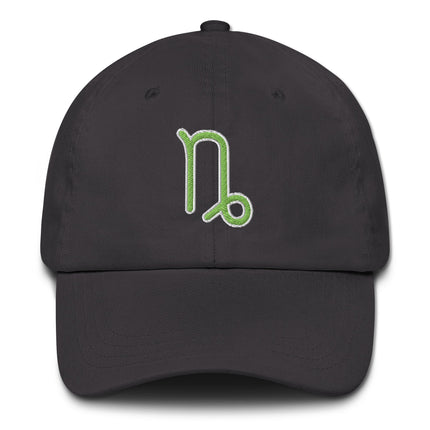 Green baseball cap embroidered with the Capricorn zodiac symbol for astrology lovers.