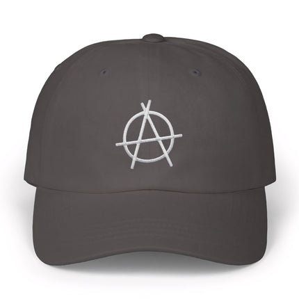 Dark gray baseball cap with white embroidered anarchy symbol. Streetwear political statement cap.