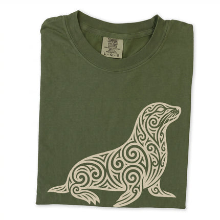Tribal swirl seal graphic tee featuring an ornate marine animal design print.