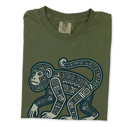 Mayan monkey graphic t-shirt featuring tribal geometric patterns and ancient Mesoamerican art symbols.